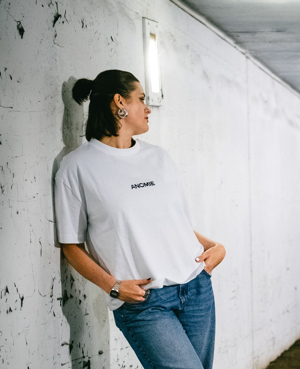Model wearing I AM NOT BROKEN TEE by Anomie, front view.